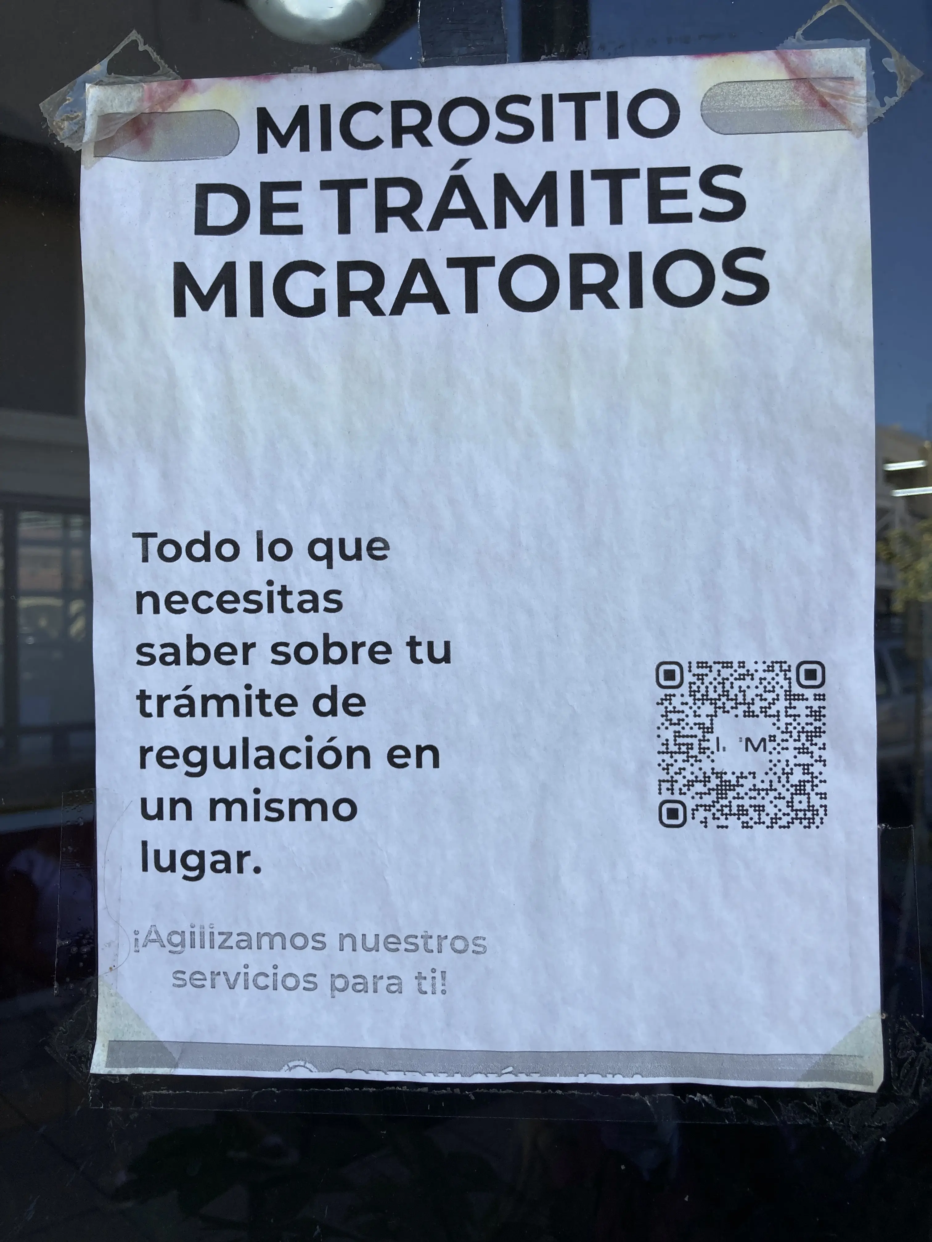 Sign on the front of the INM office door with QR code link to the micrositio