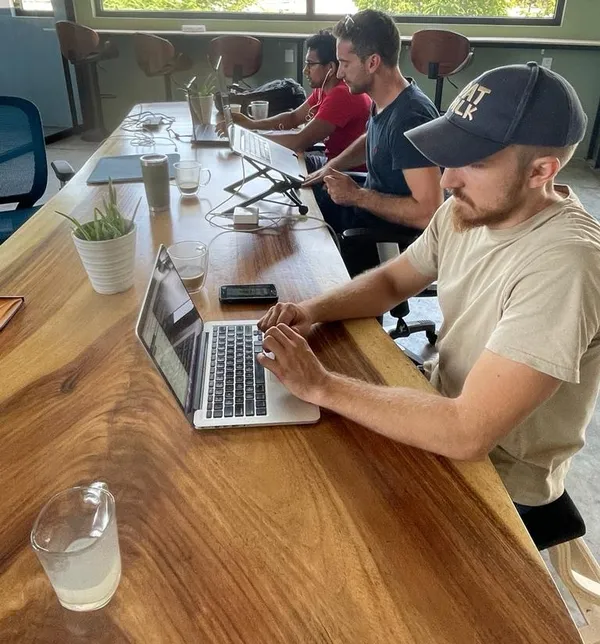 A person working comfortably at a desk with an ergonomic setup.